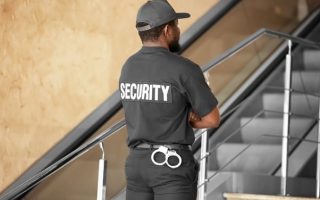 A security guard sent by a manned guarding company to work in a busy corporate environment, and ensure that no incidents occur.