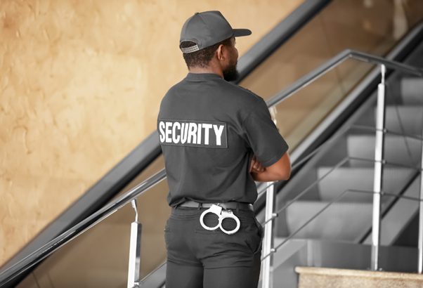 A security guard sent by a manned guarding company to work in a busy corporate environment, and ensure that no incidents occur.