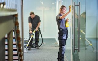 Two cleaners doing an office deep clean for a business who have switched commercial cleaning providers without disrupting their operations.
