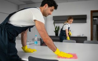A man and a woman using AI tools for cleaning businesses to ensure that standards remain consistent day after day.