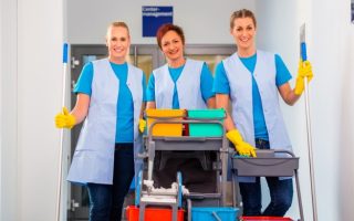 A team of cleaning staff working for a commercial cleaning company that has low staff turnover.